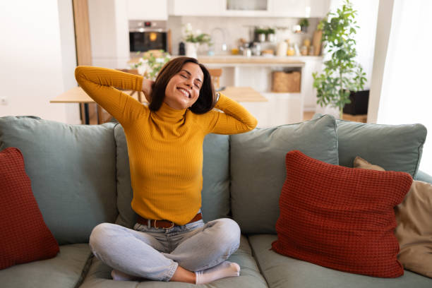 istock Relaxed Woman Enjoying A Peaceful Moment At Home On Sofa 2175459779