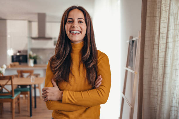 istock Smiling Woman Standing in Modern Home Interior 2175459976