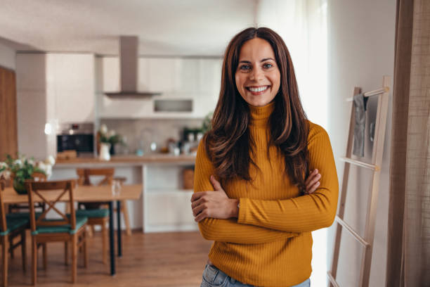 istock Smiling Woman Standing in Modern Home Interior 2175459977