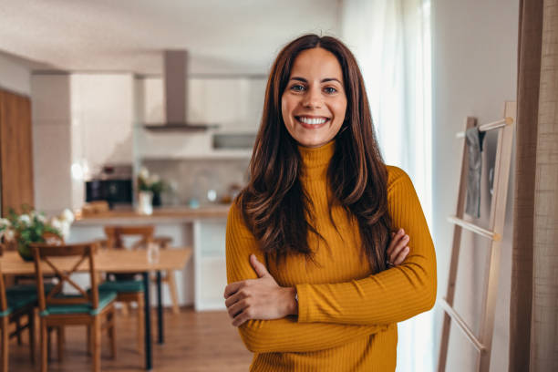 istock Smiling Woman Standing in Modern Home Interior 2175459986