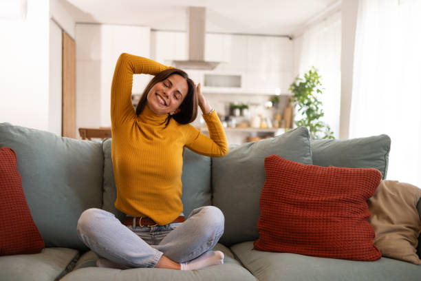 Relaxed Woman Enjoying A Peaceful Moment At Home On Sofa