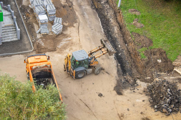 istock Aerial view of a construction site with dump truck and bulldozer 2175463443
