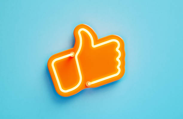 istock Orange Thumbs Up Symbol On Blue Background 2175463733