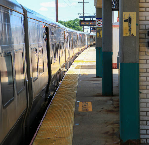 istock Long Island Railroad Train arriving at the Babylon train station 2175463770