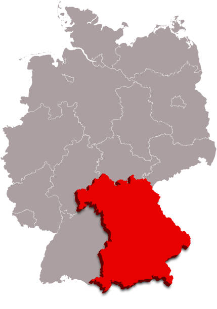 A magnifying glass focusing on Germany on a map