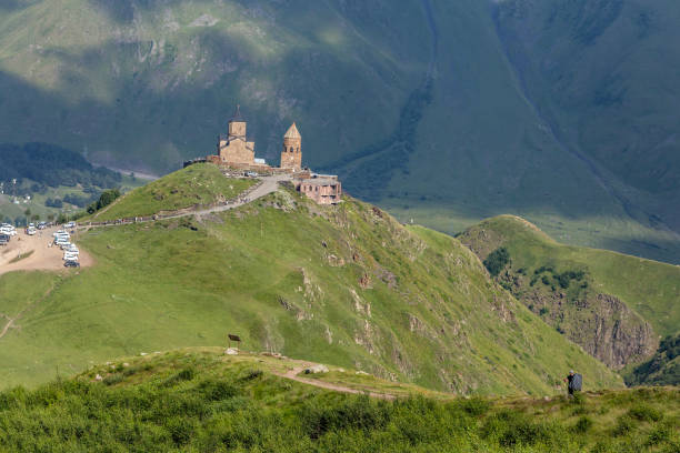 istock breathtaking view of a mountain range with a ancient Gergeti Trinity Church, under Mount Kazbek near the village of Stepantsminda in Georgia 2175499424