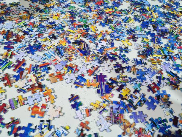 Closeup joining puzzle pieces together