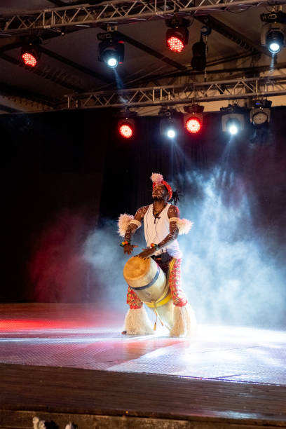 istock An African performer of authentic African rhythms performs on stage. 2175506899