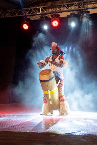istock An African performer of authentic African rhythms performs on stage. 2175506912