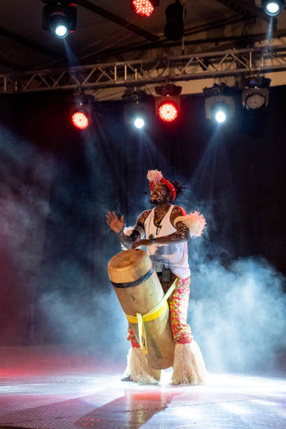 istock An African performer of authentic African rhythms performs on stage. 2175506915