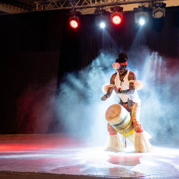 istock An African performer of authentic African rhythms performs on stage. 2175506917