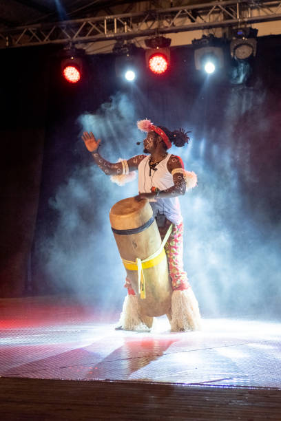 istock An African performer of authentic African rhythms performs on stage. 2175506936