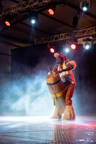 istock An African performer of authentic African rhythms performs on stage. 2175506942