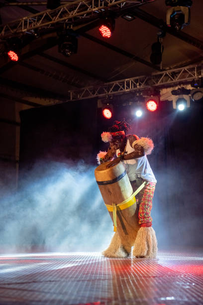 istock An African performer of authentic African rhythms performs on stage. 2175506944