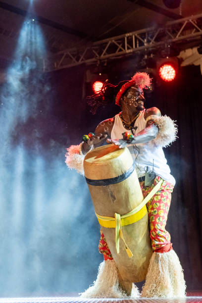 istock An African performer of authentic African rhythms performs on stage. 2175506966