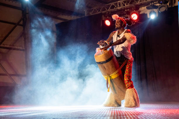 istock An African performer of authentic African rhythms performs on stage. 2175506993