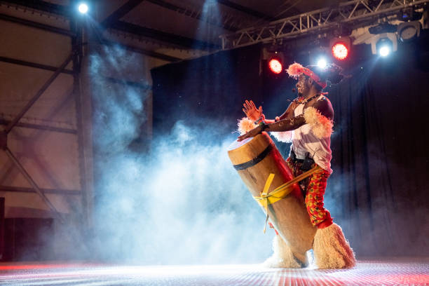 istock An African performer of authentic African rhythms performs on stage. 2175506997