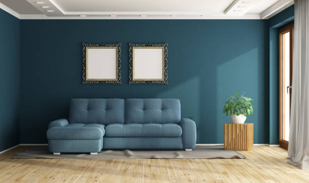 istock Modern blue living room with sofa and two empty frames showing sunlight 2175507354