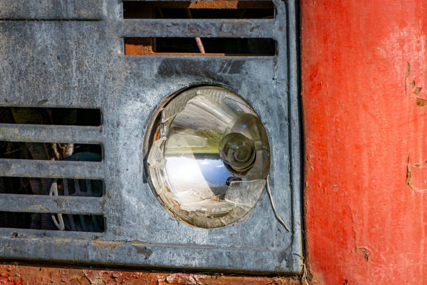 broken glass lamp in an old red car