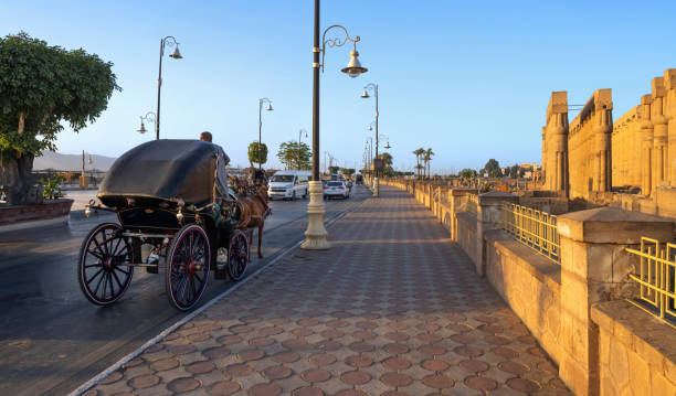Luxor, Egypt, April 15, 2023: View of the traffic on the Nile promenade in Luxor on a sunny afternoon.