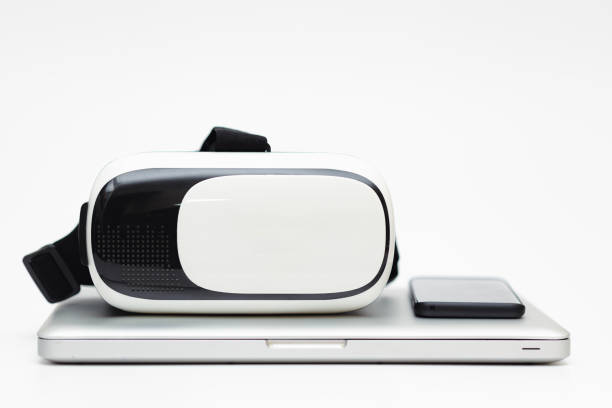 istock view of a laptop , smart phone and a VR Headset over white background 2175518272