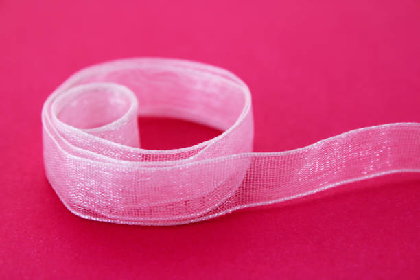 istock Rolled pink transparent and glitter ribbon 2175518439