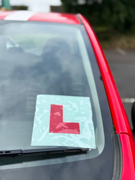 istock Image of learner driver car with l-plate displayed on windshield / a symbol of exciting journey toward driving confidence 2175520716