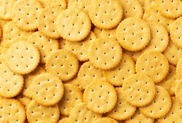 istock Round crackers background, crispy and crunchy round shape crackers, taken from above, close up. 2175521593