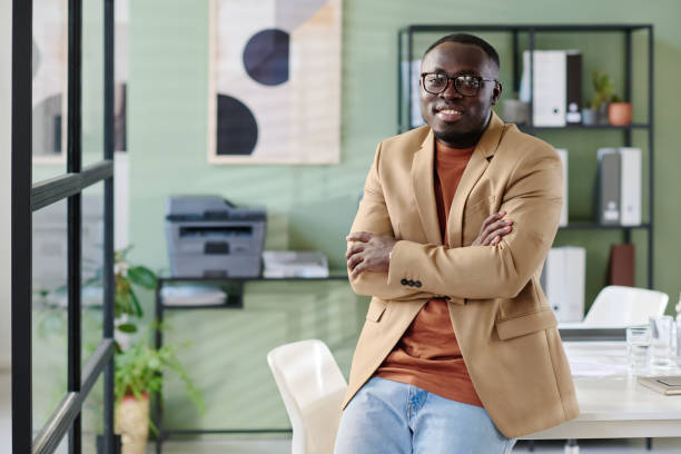 istock Portrait of Confident Young Man in Modern Office Space 2175521827