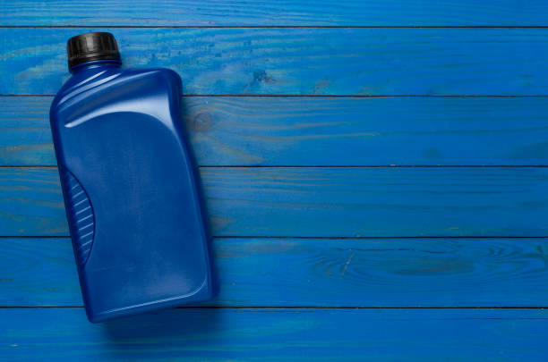 istock Machine oil on wooden background, top view 2175523180