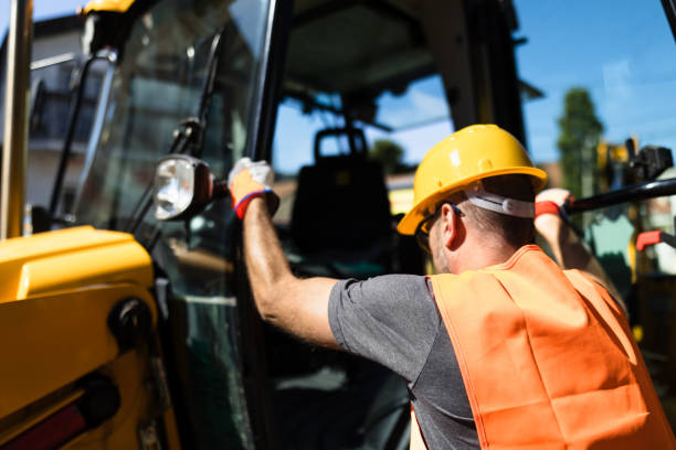 istock Construction worker in hard hat preparing to operate machinery at a job site during daytime 2175524055