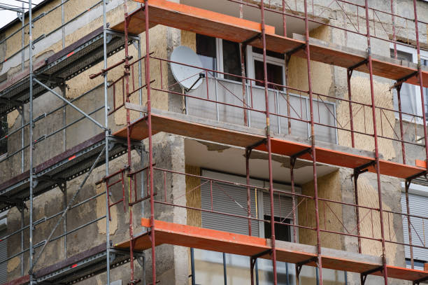istock Apartment building under renovation with scaffolding 2175527053