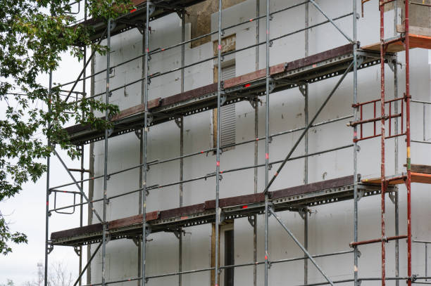 istock Apartment building under renovation with scaffolding 2175527054