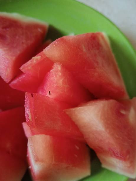 istock Fresh Watermelon Slices on a Green Plate 2175531397