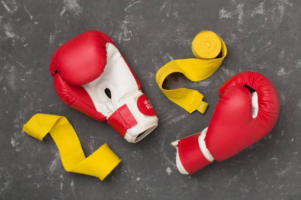 istock Red boxing gloves on concrete background, top view. 2175532865