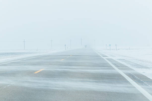 istock Blowing Snow on Highway in Winter 2175537514