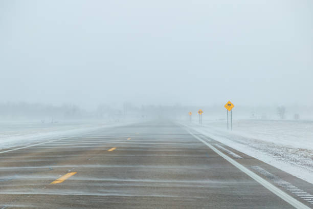 istock Blowing Snow on Highway in Winter 2175537516