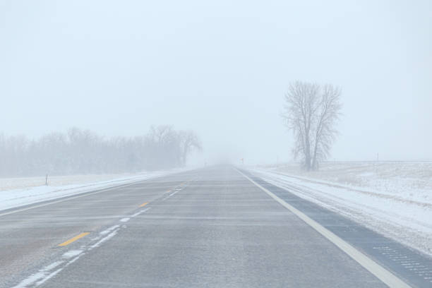 istock Blowing Snow on Highway in Winter 2175537518