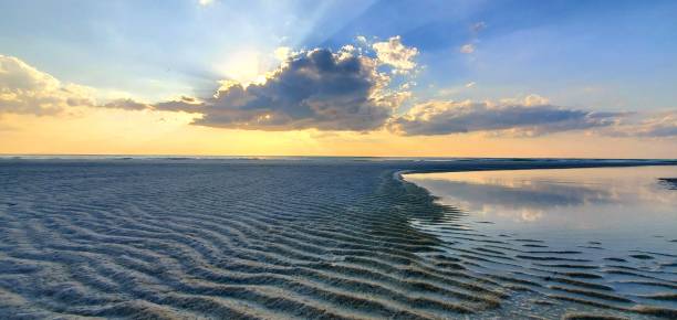 istock Waves in Sand, Beautiful Sunset, Clouds on the Beach August 2024 2175539062