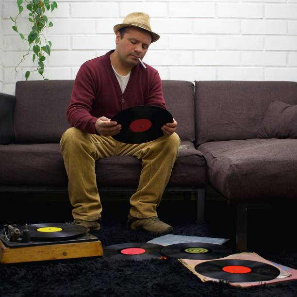istock a seated man with a hat and a cigarette reviews vinyl records 2175539182