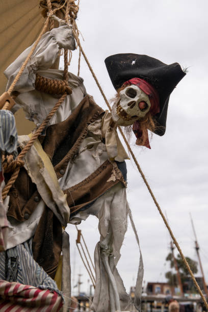 istock Pirate skeleton hanging off the side of a ship 2175539222