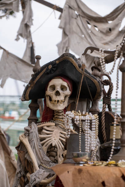 istock A pirate skeleton sits in an old pirate ship 2175539474