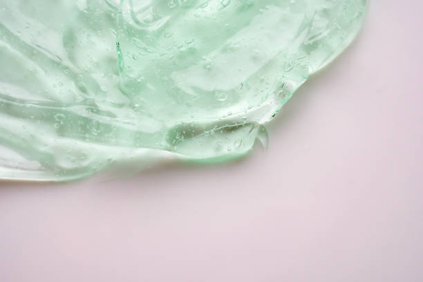istock Transparent clear green liquid serum gel cosmetic texture background 2175540803