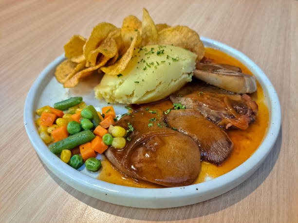 istock Delicious Bistik Lidah Or Beef Steak With Mashed Potato, Potato Chips, Grilled Oxtounge, Bestik Sauce And Mixed Vegetable. Indonesian Food Menu. 2175541438
