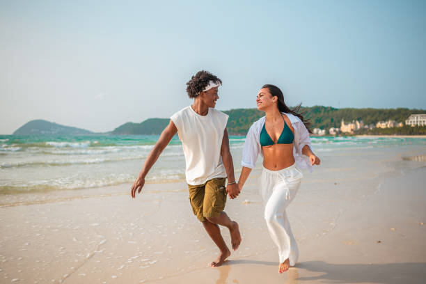 istock Joyful Interracial Couple Enjoying Beach Run 2175542995