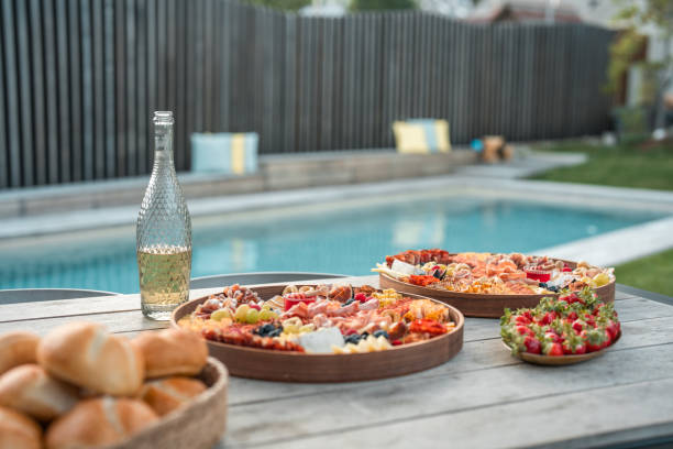 istock Lovey Cold Cut Platter and Champagne by the Pool 2175543086