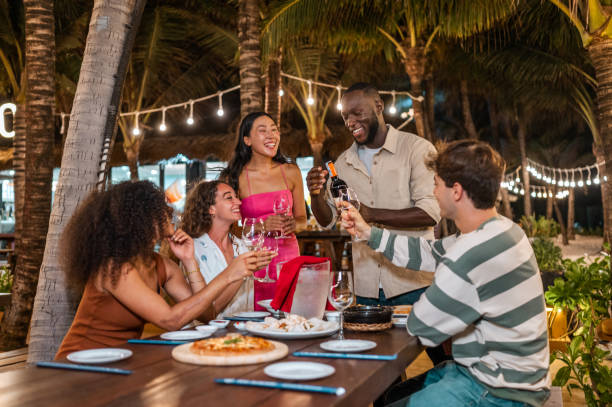 istock Joyful Dinner Party with Wine Toast under Evening Lights 2175543317