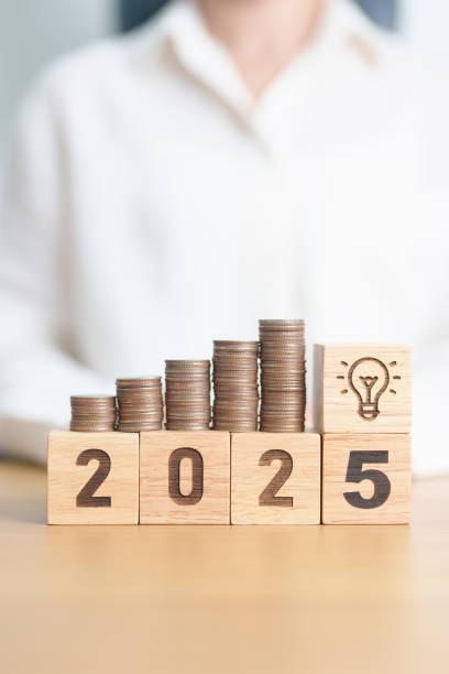 istock Happy New Year 2025 with Coins stack and lightbulb icon. Business Idea, Creative, Thinking, brainstorm,Money, Budget, investment, financial, savings and New Year Resolution concept 2175546004