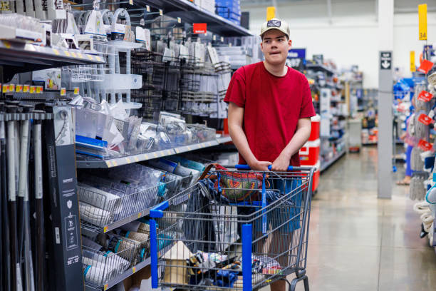 istock Navigating hardware store aisles. Young autistic man independently selects tools and supplies. 2175548725