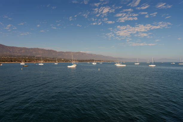 istock Boats float on water, with mountains beautifully visible behind 2175548849
